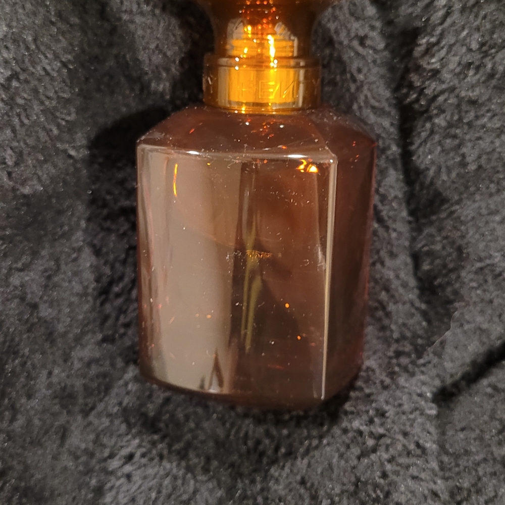 Fenty Beauty Gold and Brown Elegance Bottle